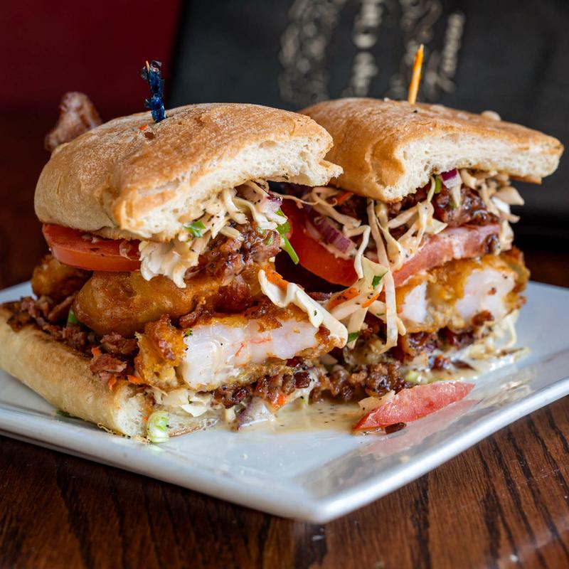 Shrimp and Bacon sandwich, with cabbage slaw, tomato, and Bama sauce.